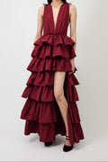 Women's burgundy deep-V evening gown with a high slit.